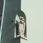 Niche Market - White Statue of a Man on a Window