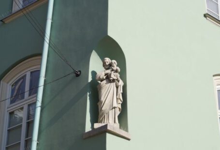 Niche Market - White Statue of a Man on a Window
