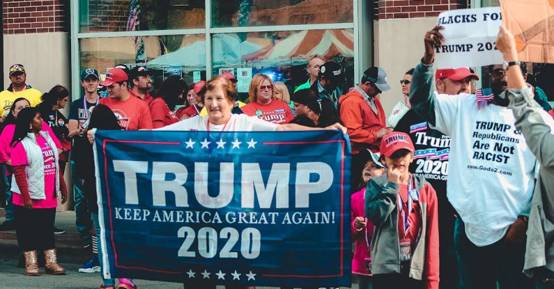 Campaign - Woman Holding Trump Keep America Great Again 2020 Banner